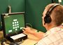 Preview of Particpant performing hearing test